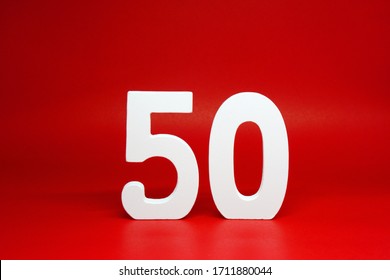 Fifty ( 50 ) white wooden number Isolated Red Background with Copy Space - New promotion 50% Percentage  Business finance Concept - Shutterstock ID 1711880044