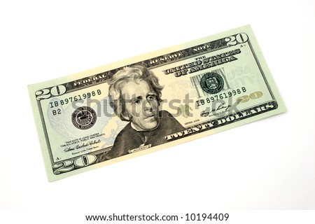 fifty dollar bill over a white surface