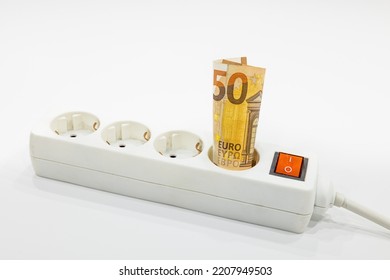 A Fifty Euro Banknote Plugged Into The Power Strip. Expensive Electricity Prices Concepts