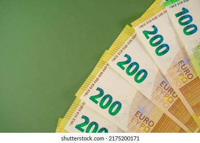 Fifty Euros Banknotes On A Green Background.Euro Currency.Money And Finance.Spending And Income In European Countries.Euro Currency Exchange Rate.Budget Allocation