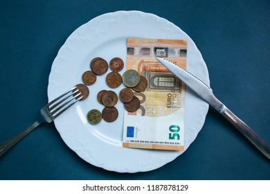 Fifty Euros Lying On The Plate With Fork And Knife. No Money Photo. Poor People Idea. Cents Coins. Small Salary And Pension Not Enough For Food. Social Problems.