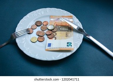 Fifty Euros Lying On The Plate With Fork And Knife. No Money Photo. Poor People Idea. Cents Coins. Small Salary And Pension Not Enough For Food. Social Problems.