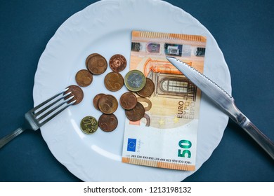 Fifty Euros Lying On The Plate With Fork And Knife. No Money Photo. Poor People Idea. Cents Coins. Small Salary And Pension Not Enough For Food. Social Problems.