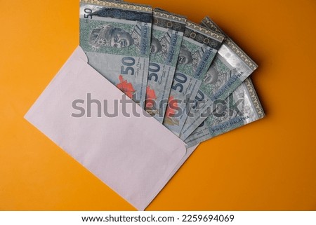 fifty Malaysian ringgit notes in an envelope. economic concept. RM. Ringgit Malaysia. 