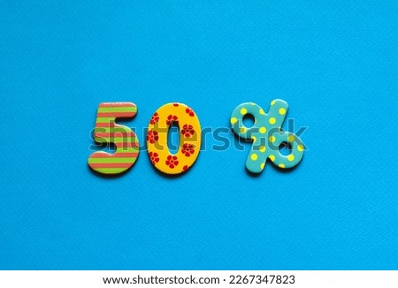 fifty percent on blue paper background