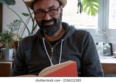 Fifty Year Old Spanish Man With Hat With A Book