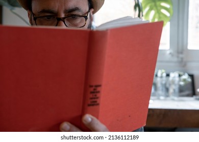 Fifty Year Old Spanish Man With Hat With A Book