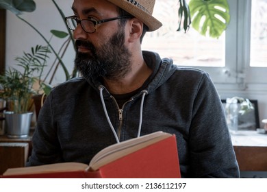 Fifty Year Old Spanish Man With Hat With A Book