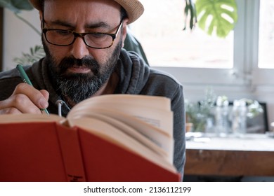 Fifty Year Old Spanish Man With Hat With A Book