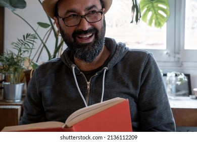 Fifty Year Old Spanish Man With Hat With A Book