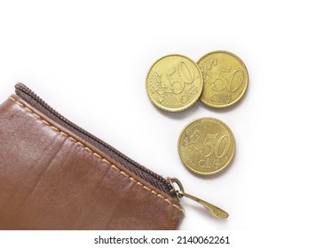 Fifty-cent coins by a leathern purse. European Union coins on white background. EU metal money. 50 Cent Euro Coins