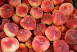 Fig Flat Peaches. Juicy Ripe Fig Peaches Fruit. Red Mature Fig Peaches Background, Agricultural Products, Sale In Farmers Market. Harvest Season. Top View, Horizontal, Vertical