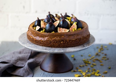 Fig Honey Pistachio Cheesecake On A Marble Cake Stand Against White Brick Wall Copy Space Autumn Winter Holiday Dessert