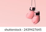 Fight against breast cancer. Pair of pink boxing gloves on color background, space for text. Banner design