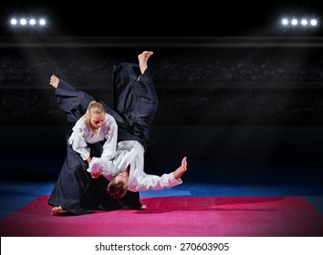 Fight between two aikido fighters at sport hall