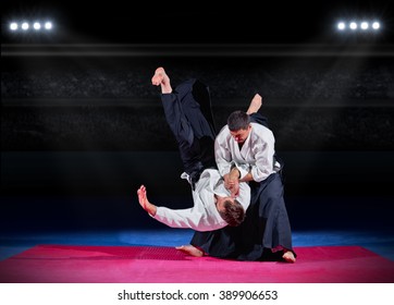 Fight between two aikido fighters at sport hall