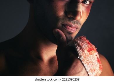 Fight, Blood And Portrait Of Man With Bruise On Eye, Face And Bloody Bandages On Hand. Violence, Boxing And Young Male Boxer With Injury, Wounds And Hurt From Mma Sport On Black Background In Studio