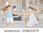 Fight, children and tablet in home with conflict, frustrated and sharing argument. Sisters, kids pulling and digital tech in living room with bad behavior, bullying and sibling rivalry at lounge sofa