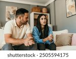 Fight, divorce and depression with couple on sofa for conflict, therapy and mental health or marriage counseling