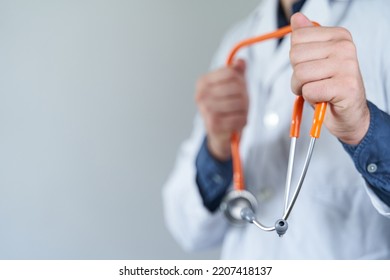 Fight For Health Care Concept. Fist In Fight Position Holding Stethoscope