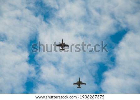 Fighter aircrafts against the background of the blue sky