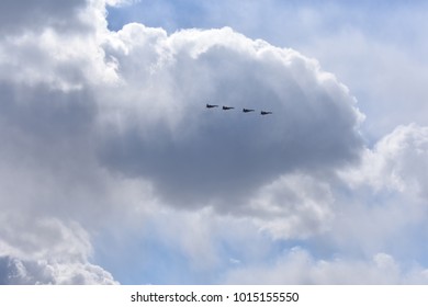 Fighter in the blue sky with white clouds