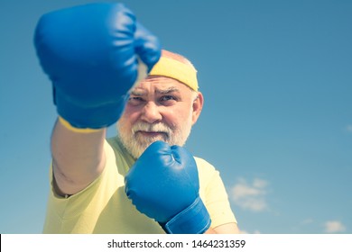 Fighter. Boxer With Boxing Glove. Senior Man In Gloves Beats Punching Bag. Boxing. Older Man Boxing. I Love Boxing. Senior Cool Man Fighting