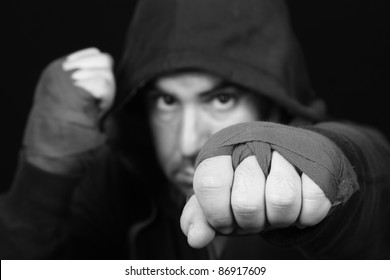 Fighter in concentration moment (focus in the face), B & W photo