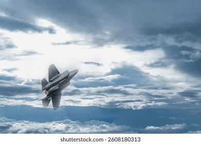 Fighter jet flying through cloudy blue sky on background with copy space