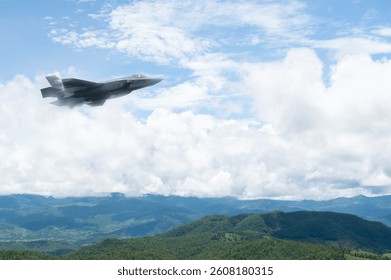 Fighter jet flying through cloudy blue sky on background with copy space