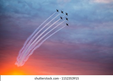 Fighter Jets Doing Demonstrations At One Air Show Organized By International Airport From Timisoara. Sunset Time.