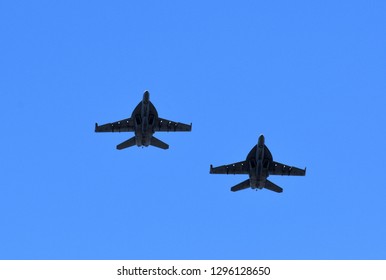 Fighter jets fly in formation.