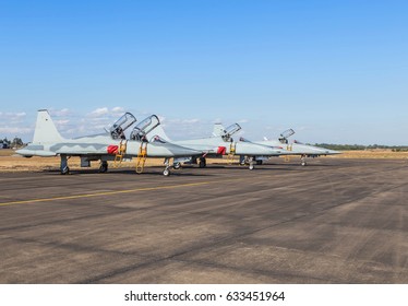 Fighter Jets Military Aircraft Parked In The Airforce Base On Blue Sky Background