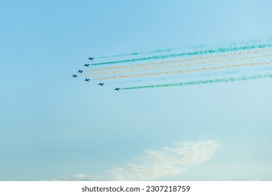 Fighter jets squadron with traces in Saudi Arabian national flag colors, at Jeddah air show - Powered by Shutterstock