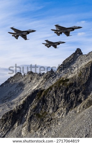 Fighter jets surge across a sharp mountain ridge, a dramatic alpine landscape showcasing precision flight. 3d Rendering Military Aircraft. Background image from British Columbia, Canada