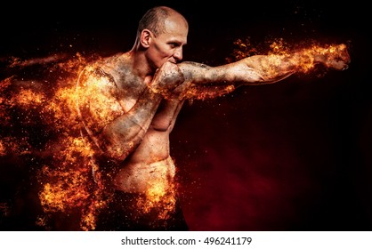 Fighter man in fire. Sport advertising. MMA boxer.
