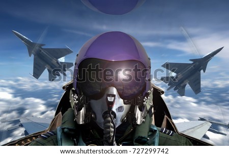 Fighter pilot cockpit view during sunrise
