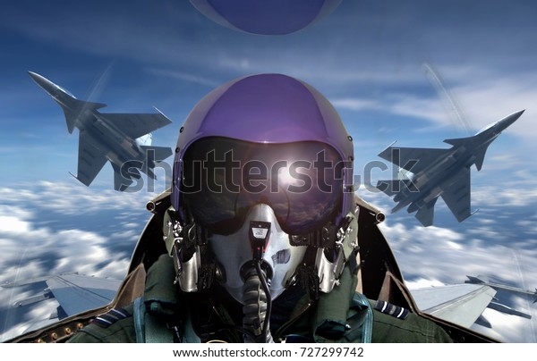 Fighter pilot cockpit\
view during sunrise
