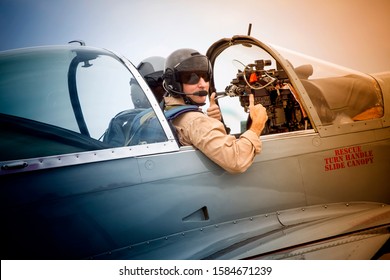 Fighter Pilot In Cockpit While Taxing On Runway Looking Back Giving Thumbs Up With Copilot Also Present