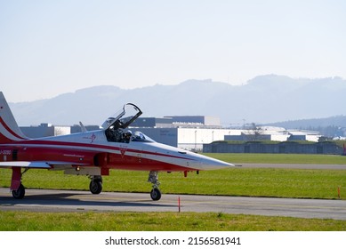 Fighter plane Northrop F-5E Tiger II of Patrouille Suisse taxiing to start at Swiss Air Force Airbase Emmen, Canton Lucerne, on a sunny spring noon. Photo taken March 23rd, 2022, Emmen, Switzerland.