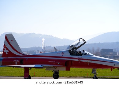 Fighter plane Northrop F-5E Tiger II of Patrouille Suisse taxiing to start at Swiss Air Force Airbase Emmen, Canton Lucerne, on a sunny spring noon. Photo taken March 23rd, 2022, Emmen, Switzerland.