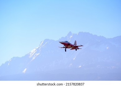 Fighter plane Northrop F-5E Tiger II of Patrouille Suisse landing at Swiss Air Force Airbase Emmen, Canton Lucerne, on a sunny spring noon. Photo taken March 23rd, 2022, Emmen, Switzerland.