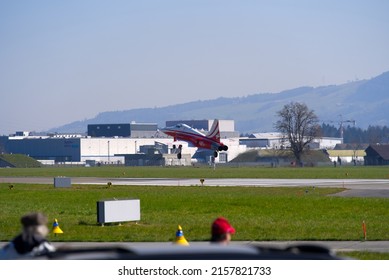 Fighter plane Northrop F-5E Tiger II of Patrouille Suisse landing at Swiss Air Force Airbase Emmen, Canton Lucerne, on a sunny spring noon. Photo taken March 23rd, 2022, Emmen, Switzerland.