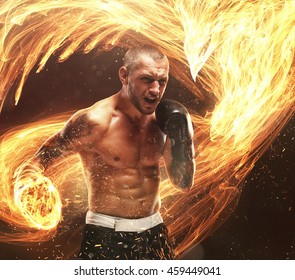 Fighter's Burning Punch With Phoenix Fire Bird On Background.