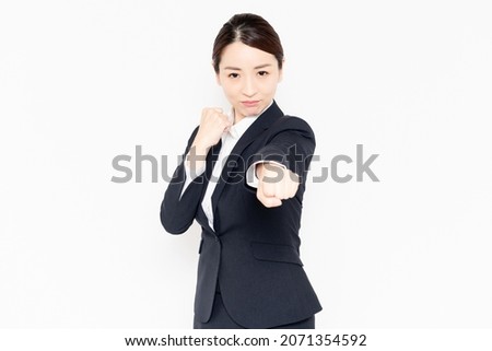 Fighting business woman in a fighting pose