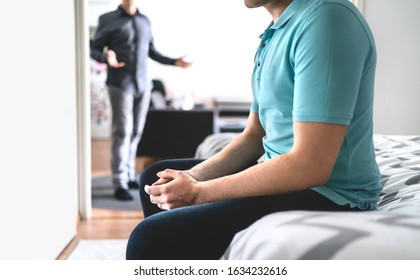 Fighting Gay Couple. Angry And Sad Man With Crisis And Stress. Brothers In Argument Or Friends In Conflict.  Jealous Unhappy Guy Having Issues. Sitting On Bed. Bad Relationship. Infidelity Or Jealousy