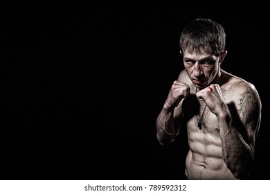 Fighting Man With Bloody  Knuckles On Black Background