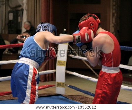 fighting on boxing ring