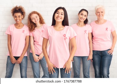 Fighting Oncology. Smiling Asian Woman Standing With Breast Cancer Support Group Posing On White Background. Selective Focus - Powered by Shutterstock