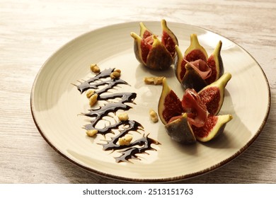 Figs and prosciutto with balsamic vinegar and nuts in a beige plate on a light wooden countertop. 45 degrees view with professional studio lighting. Horizontal frame. Gourmet style plating. - Powered by Shutterstock